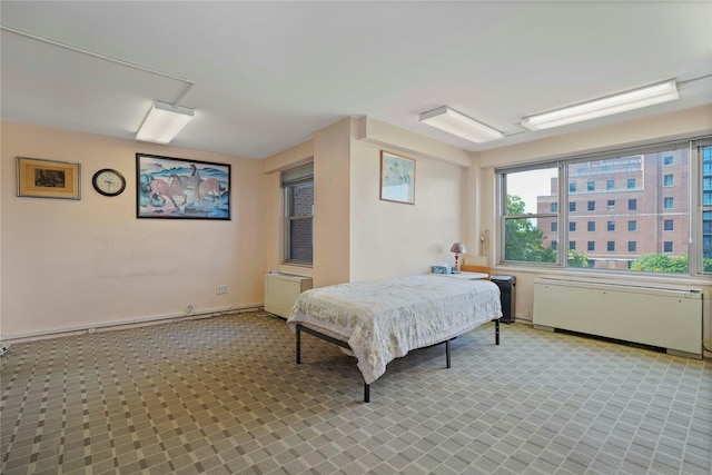 70-20 108th St Unit 5P, Forest Hills, NY 11375 - bedroom featuring radiator heating unit and light colored carpet