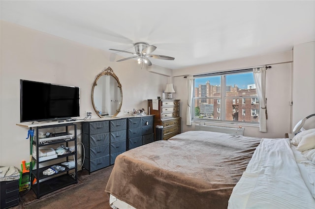 70-20 108th St Unit 5P, Forest Hills, NY 11375 - bedroom featuring dark colored carpet and a ceiling fan