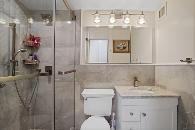 70-20 108th St Unit 5P, Forest Hills, NY 11375 - bathroom featuring vanity, tile walls, and a marble finish shower
