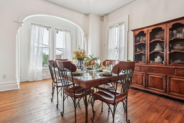 223 Warburton Ave, Yonkers, NY 10701 - dining room featuring ornamental molding, wood finished floors, and arched walkways