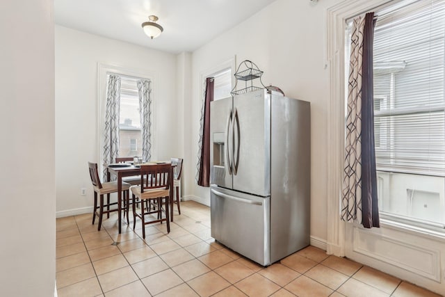 223 Warburton Ave, Yonkers, NY 10701 - kitchen with stainless steel refrigerator with ice dispenser and light tile patterned floors