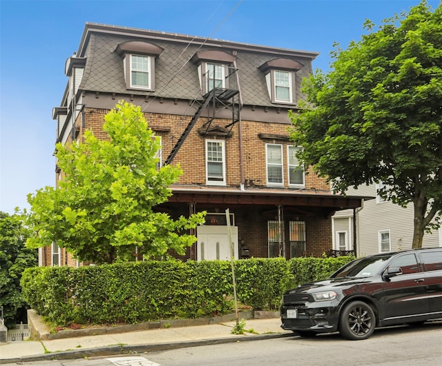 223 Warburton Ave, Yonkers, NY 10701 - second empire-style home with mansard roof and brick siding