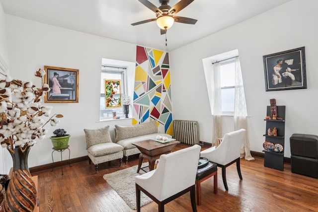 223 Warburton Ave, Yonkers, NY 10701 - living room featuring ceiling fan, radiator heating unit, and wood finished floors