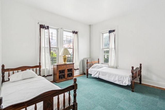 223 Warburton Ave, Yonkers, NY 10701 - bedroom featuring wood finished floors and radiator heating unit