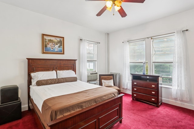 223 Warburton Ave, Yonkers, NY 10701 - bedroom with dark carpet, multiple windows, radiator heating unit, and a ceiling fan