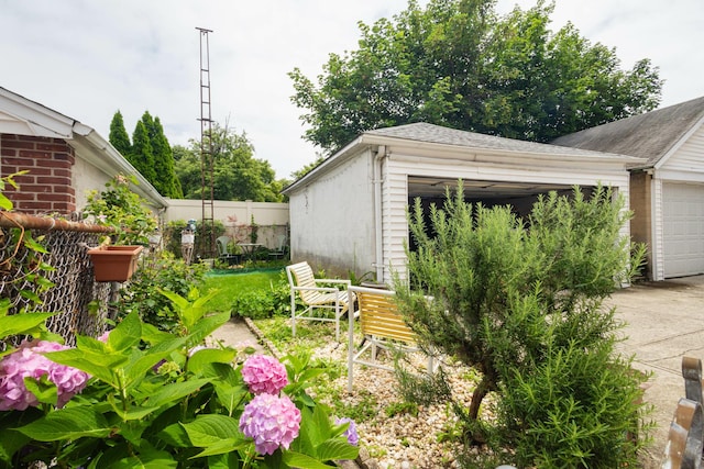 40-29 201st St Unit A, B, C, Bayside, NY 11361 - view of yard with a garage and an outbuilding