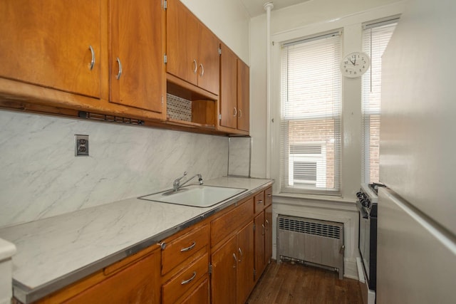 40-29 201st St Unit A, B, C, Bayside, NY 11361 - kitchen featuring radiator, freestanding refrigerator, tasteful backsplash, range, and brown cabinets
