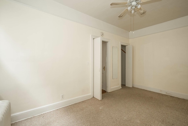 40-29 201st St Unit A, B, C, Bayside, NY 11361 - spare room featuring radiator heating unit, light carpet, and ceiling fan