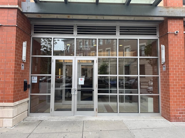 837 Washington Ave Unit 3A, Bronx, NY 10451 - entrance to property featuring brick siding and a surveillance system
