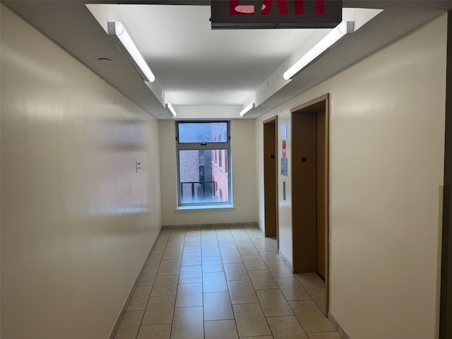 837 Washington Ave Unit 3A, Bronx, NY 10451 - corridor featuring light tile patterned floors and elevator
