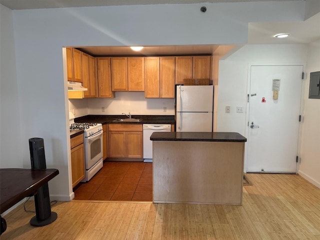 837 Washington Ave Unit 3A, Bronx, NY 10451 - kitchen with white appliances, under cabinet range hood, electric panel, and dark countertops
