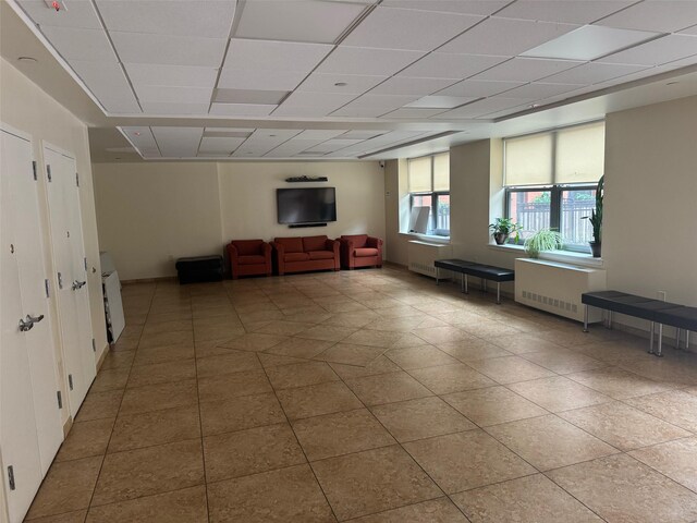 837 Washington Ave Unit 3A, Bronx, NY 10451 - tiled living room featuring radiator