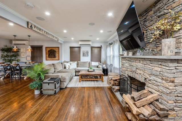 35 Irenhyl Ave, Port Chester, NY 10573 - living room featuring a wall mounted AC, wood finished floors, crown molding, a fireplace, and recessed lighting