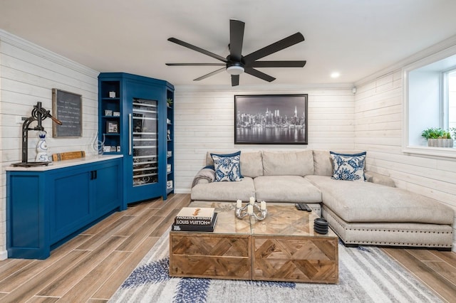 35 Irenhyl Ave, Port Chester, NY 10573 - living area featuring wood walls, light wood-type flooring, a ceiling fan, and beverage cooler