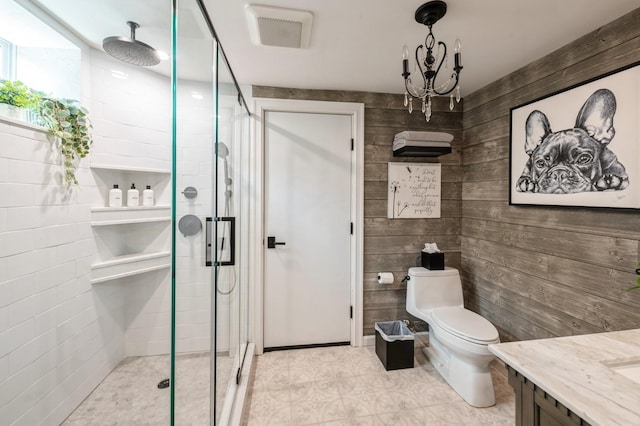35 Irenhyl Ave, Port Chester, NY 10573 - full bathroom featuring a shower stall, vanity, wood walls, tile patterned flooring, and a chandelier