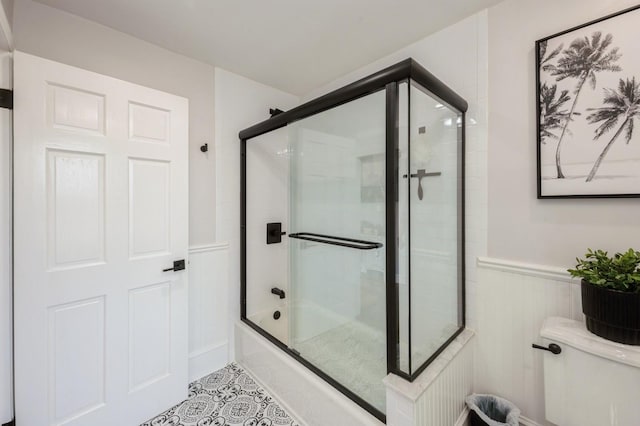 35 Irenhyl Ave, Port Chester, NY 10573 - full bathroom with a wainscoted wall, shower / bath combination with glass door, and tile patterned floors