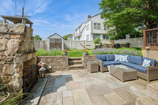 35 Irenhyl Ave, Port Chester, NY 10573 - fenced backyard featuring a patio, an outdoor hangout area, and a storage unit