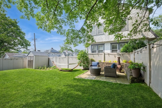 35 Irenhyl Ave, Port Chester, NY 10573 - fenced backyard featuring a patio area, a shed, and a residential view
