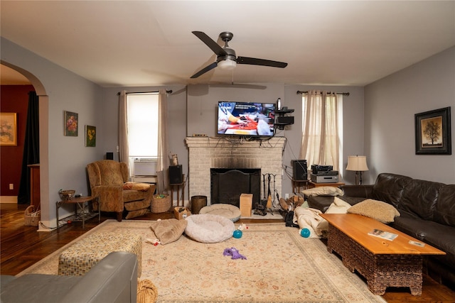 3344 Giles Pl, Bronx, NY 10463 - living area featuring wood finished floors, arched walkways, a ceiling fan, and a brick fireplace