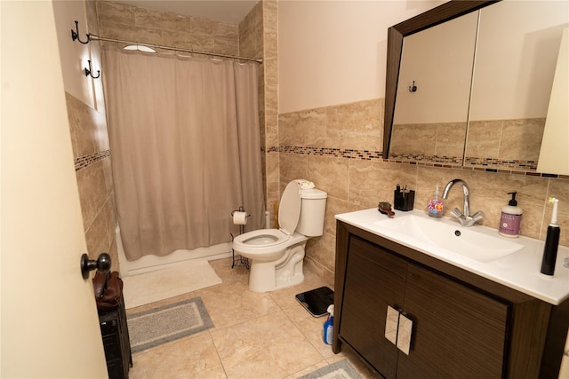 3344 Giles Pl, Bronx, NY 10463 - bathroom featuring vanity, shower / bathtub combination with curtain, tile walls, a wainscoted wall, and tile patterned flooring