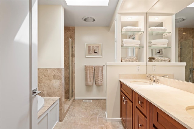 41 Park Cir, Quogue, NY 11959 - bathroom featuring a stall shower, double vanity, a garden tub, and a skylight