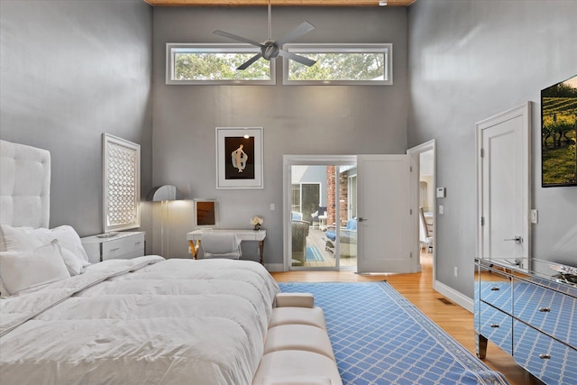 41 Park Cir, Quogue, NY 11959 - bedroom with a towering ceiling and light wood-style floors