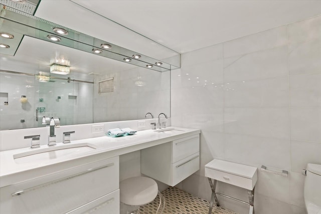 41 Park Cir, Quogue, NY 11959 - bathroom with tile walls, double vanity, a shower stall, and tile patterned floors