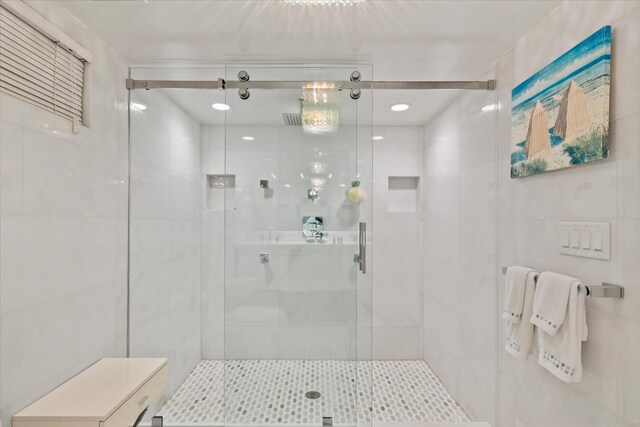 41 Park Cir, Quogue, NY 11959 - full bathroom featuring a stall shower and tile walls
