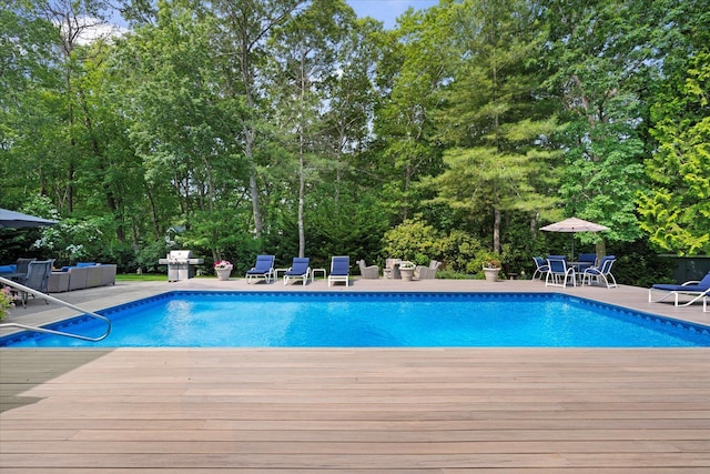 41 Park Cir, Quogue, NY 11959 - swimming pool featuring an outdoor hangout area, a deck, outdoor dining space, grilling area, and a patio