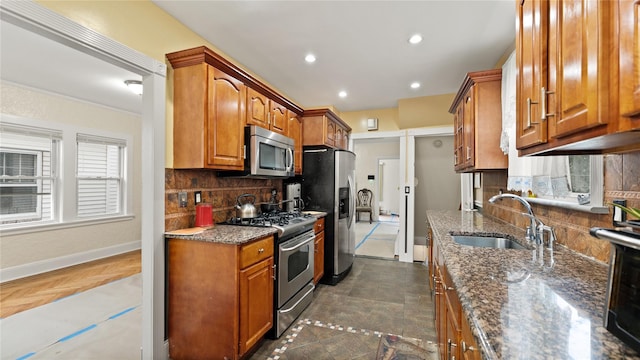 236 N High St, Mount Vernon, NY 10550 - kitchen featuring stainless steel appliances, brown cabinets, backsplash, dark stone countertops, and recessed lighting