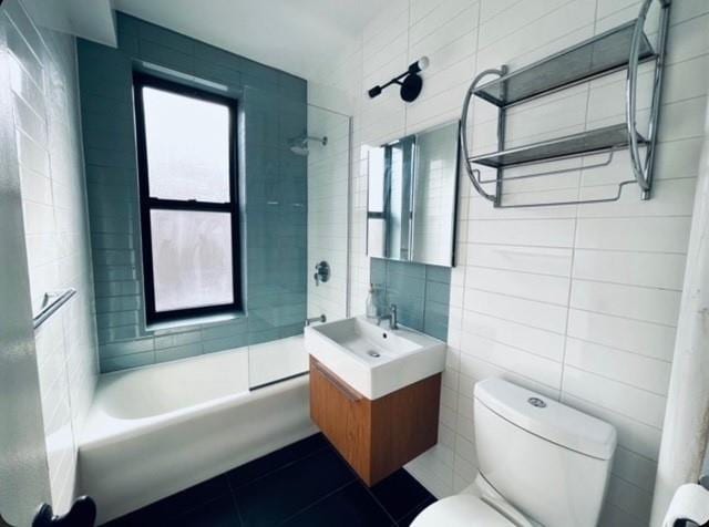 41-42 42nd St Unit 4L, Sunnyside, NY 11104 - full bath with tile walls, vanity, plenty of natural light, tile patterned floors, and  shower combination