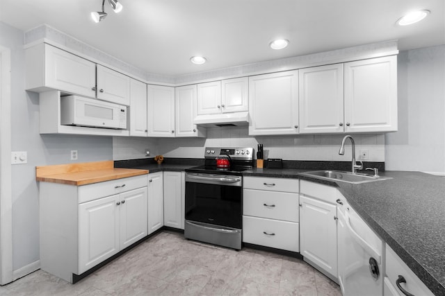 5 Rose Ests Unit 2, Walden, NY 12586 - kitchen featuring white appliances, under cabinet range hood, white cabinets, and recessed lighting