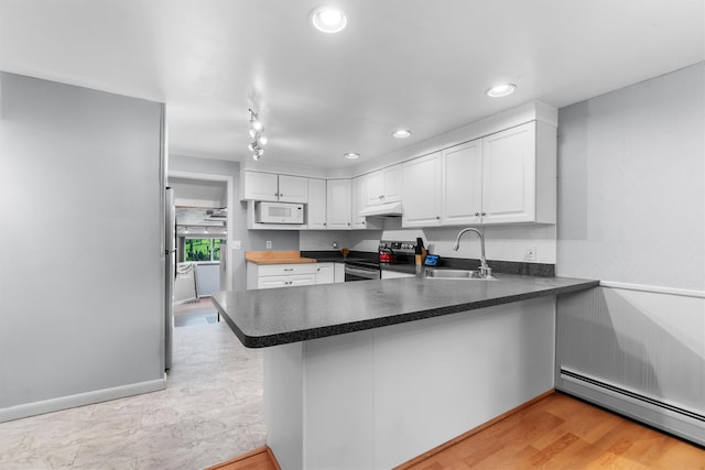 5 Rose Ests Unit 2, Walden, NY 12586 - kitchen with stainless steel electric stove, baseboard heating, white microwave, a peninsula, and white cabinetry