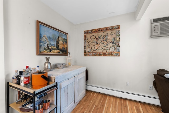 5 Rose Ests Unit 2, Walden, NY 12586 - home office featuring a baseboard radiator, an AC wall unit, and light wood-style flooring