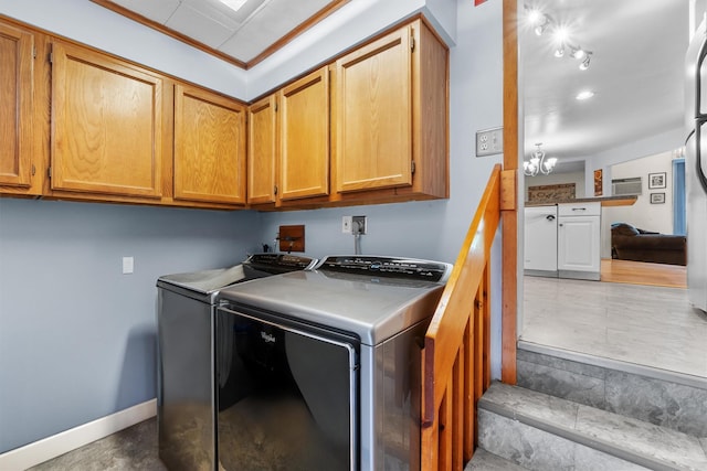 5 Rose Ests Unit 2, Walden, NY 12586 - laundry area with washer and dryer, cabinet space, a chandelier, and ornamental molding
