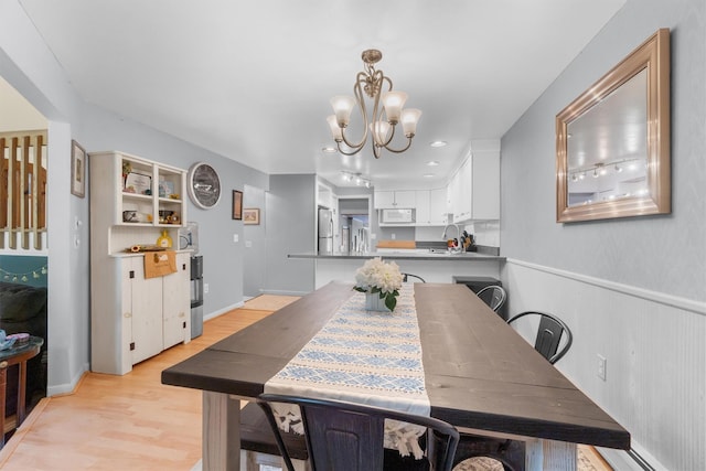 5 Rose Ests Unit 2, Walden, NY 12586 - dining space with a chandelier and light wood finished floors