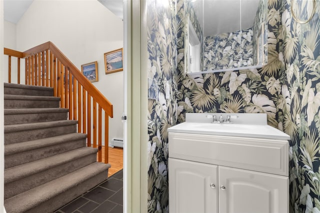 5 Rose Ests Unit 2, Walden, NY 12586 - bathroom with wallpapered walls, a baseboard heating unit, and vanity