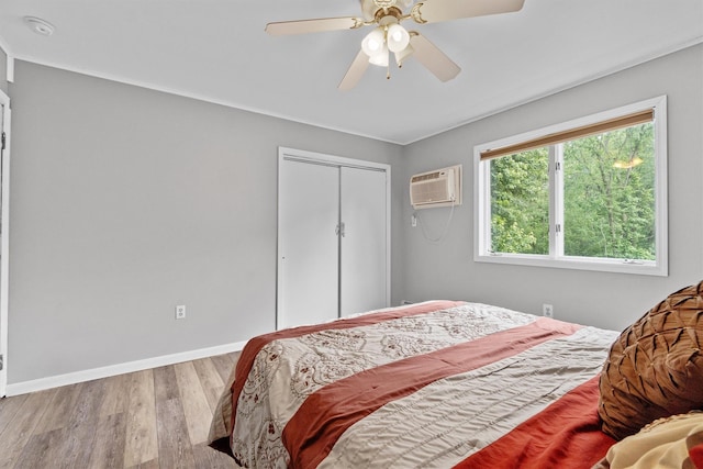 5 Rose Ests Unit 2, Walden, NY 12586 - bedroom with a wall mounted air conditioner, wood finished floors, a closet, and a ceiling fan