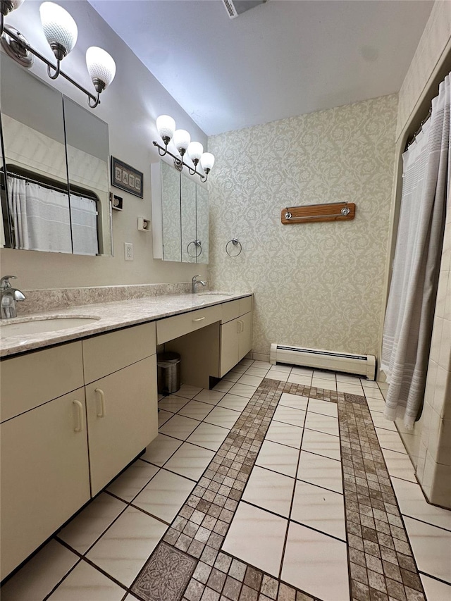 5 Rose Ests Unit 2, Walden, NY 12586 - bathroom featuring baseboard heating, double vanity, wallpapered walls, and tile patterned floors