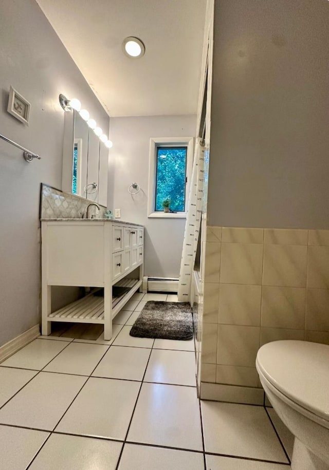 5 Rose Ests Unit 2, Walden, NY 12586 - bathroom featuring vanity, tile patterned flooring, shower / tub combo, and a baseboard heating unit