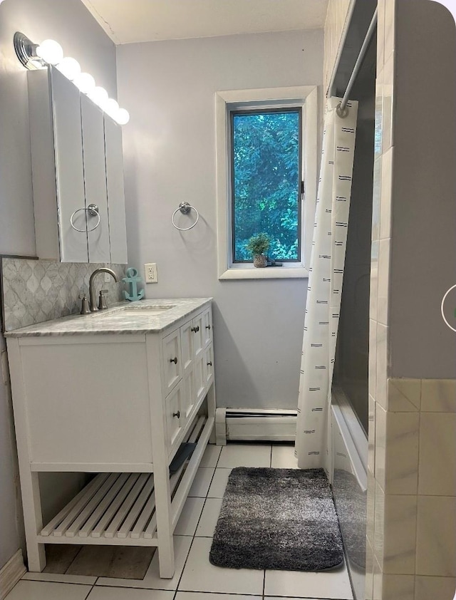 5 Rose Ests Unit 2, Walden, NY 12586 - full bath featuring a baseboard heating unit, vanity, tile patterned floors, shower / tub combo with curtain, and decorative backsplash