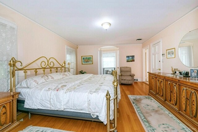 1 Ravine Rd, Great Neck, NY 11023 - bedroom with wood finished floors