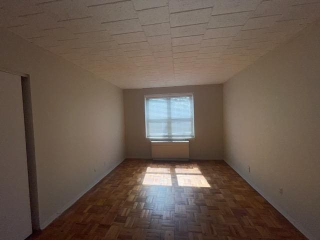 125 Main St Unit 2H, Port Washington, NY 11050 - spare room with baseboards