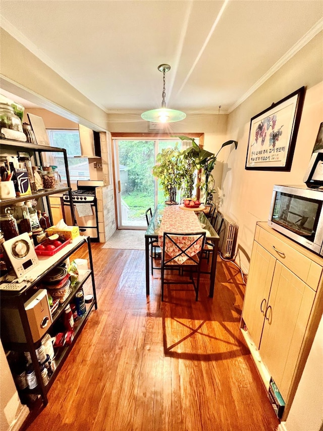 4328 195th St, Flushing, NY 11358 - dining room featuring light wood-style flooring and crown molding