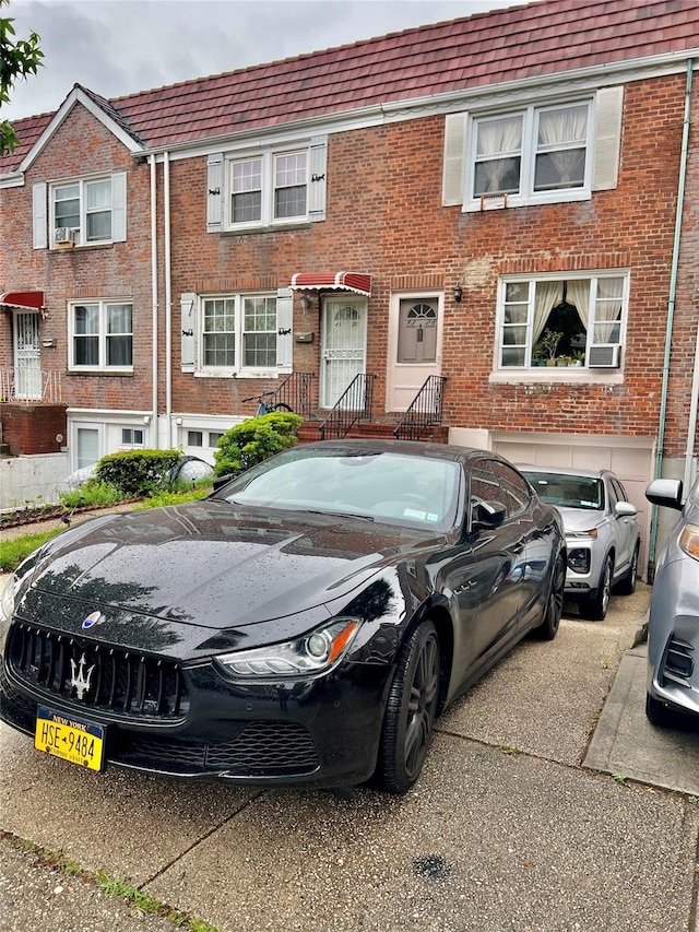 4328 195th St, Flushing, NY 11358 - townhome / multi-family property featuring brick siding and driveway