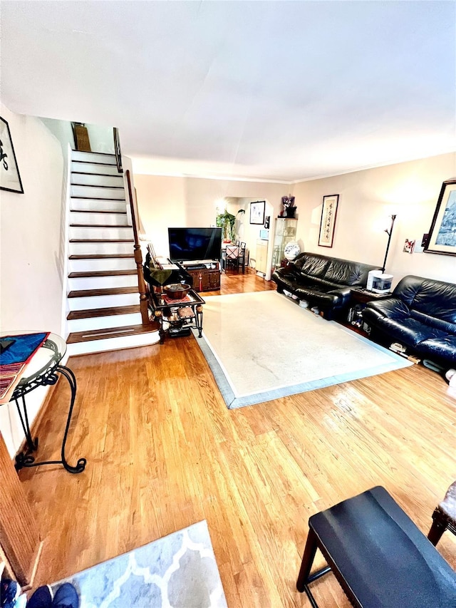 4328 195th St, Flushing, NY 11358 - living room featuring wood finished floors and stairs