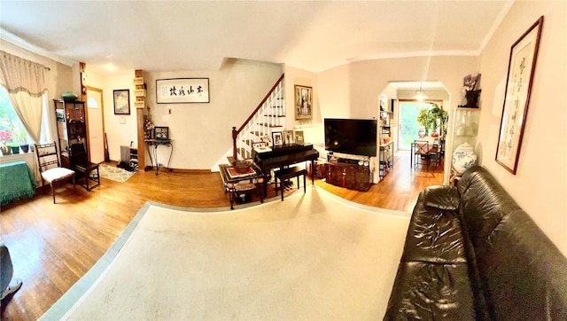 4328 195th St, Flushing, NY 11358 - living area featuring wood finished floors, arched walkways, healthy amount of natural light, and ornamental molding