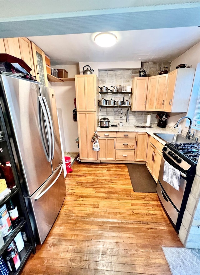 4328 195th St, Flushing, NY 11358 - kitchen featuring light brown cabinetry, stainless steel appliances, open shelves, light wood-style floors, and light countertops