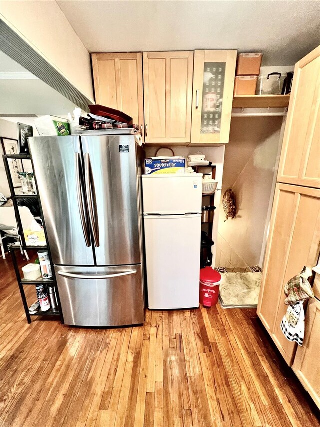 4328 195th St, Flushing, NY 11358 - kitchen featuring freestanding refrigerator, light wood-style floors, and light brown cabinets