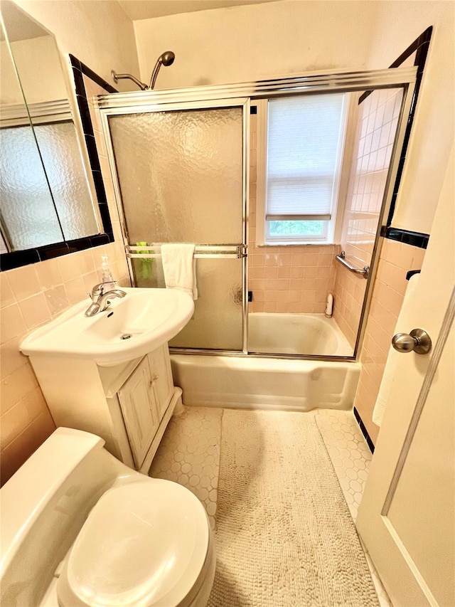 4328 195th St, Flushing, NY 11358 - bathroom with bath / shower combo with glass door, vanity, and tile walls